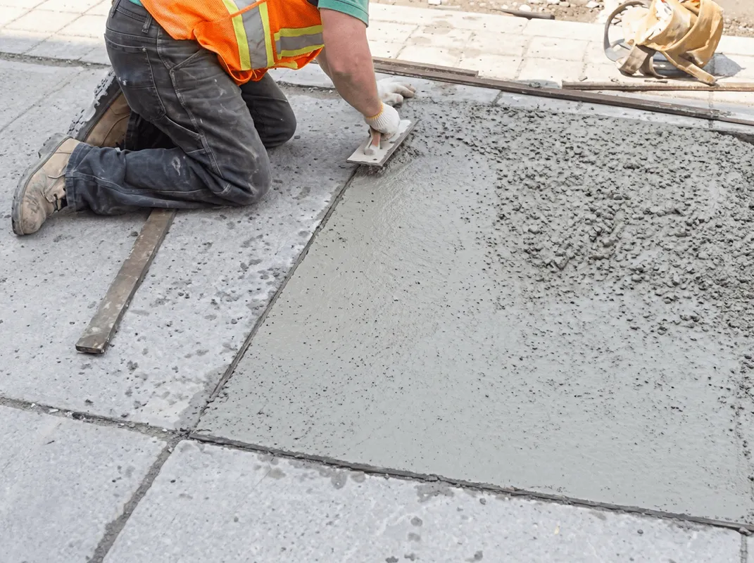 Professional repairing a concrete floor in Philadelphia, PA